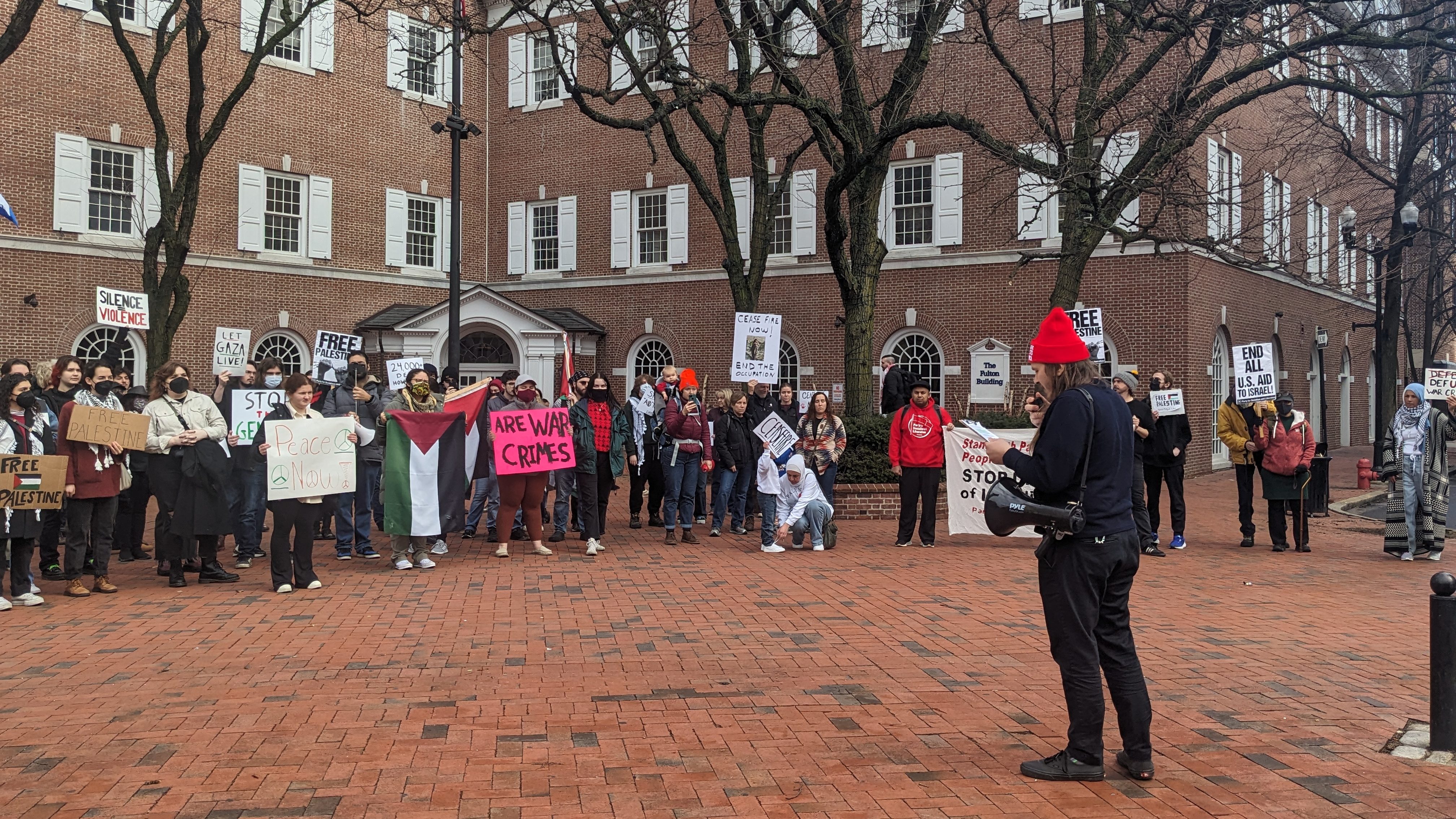 Speaker at a rally at Penn Square